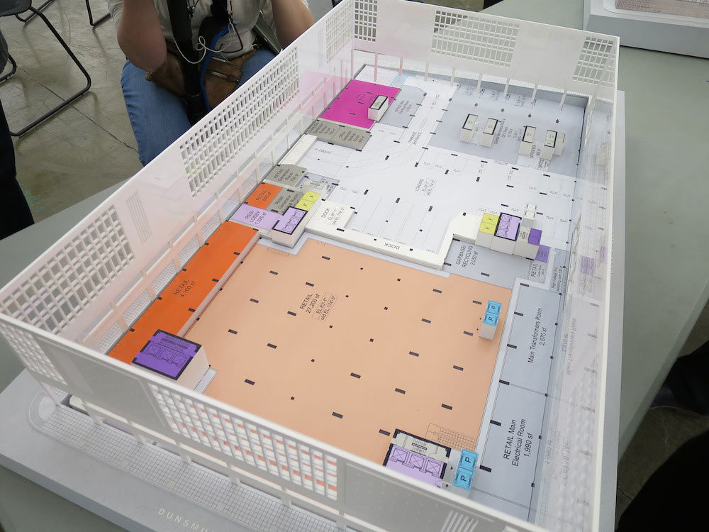 Diagram model of the first floor of showing retail (light orange and orange).!
